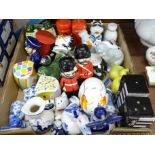 A collection of novelty salt and pepper pots including Delft, etc.