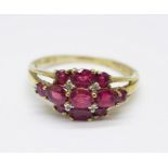 A 9ct gold, ruby and diamond cluster, 2.8g, S