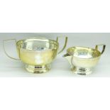 A silver sugar bowl and cream jug, 271g