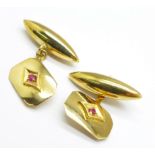 A pair of 18ct gold cufflinks set with red stones, 5.4g