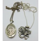 A silver dragon pendant and chain and a silver dragon locket and chain