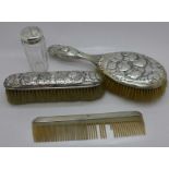 Two silver brushes with Reynolds Angels, a jar and comb, comb a/f