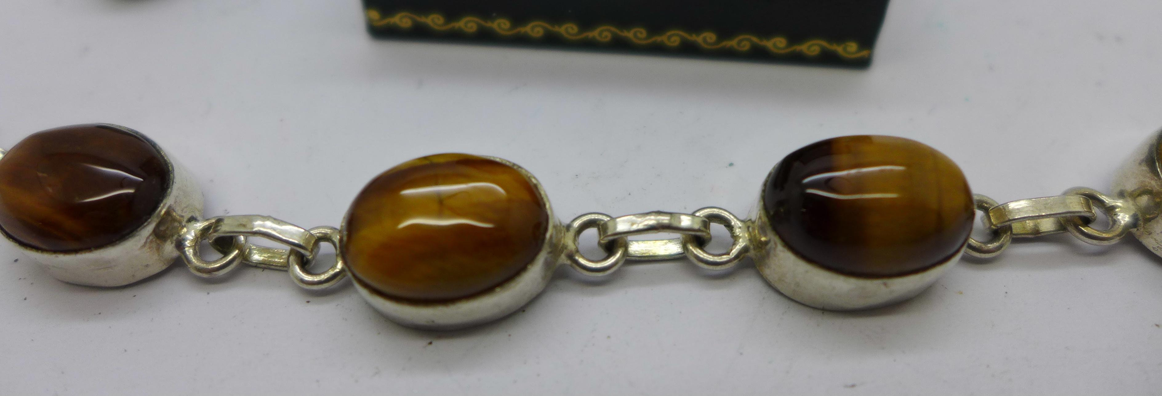 A silver and tigers eye bracelet, jade and silver earrings and a silver enamelled ring - Image 2 of 3