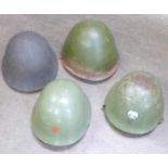 Four steel helmets including Russian and Swiss
