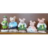 Four Wade Nat West pig money banks and a Nottingham Building Society Robin Hood money box, boxed