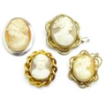 A yellow metal set cameo brooch, a hallmarked silver set cameo brooch and two other cameo