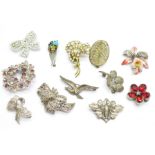 Twelve costume brooches including marcasite and a silver bird brooch