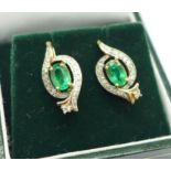 A pair of 9ct gold, emerald and diamond earrings