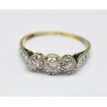 An 18ct gold, platinum set three stone diamond ring, 2.3g, Q