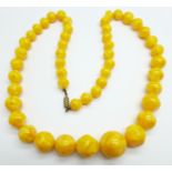 A yellow Bakelite necklace