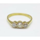 An 18ct gold and three stone diamond ring, over 0.5carat diamond weight, 3.1g, S