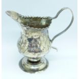 A George III silver cream jug, London 1784, a/f, 66g