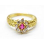 An 18ct gold, ruby and white stone cluster ring, 3.4g, L