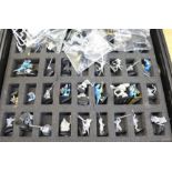 A collection of Warhammer figures in Games Workshop case