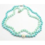 An 'aquamarine' faceted bead necklace and a pearl and turquoise coloured bead necklace