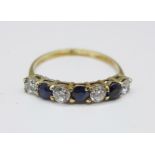 A 9ct gold, sapphire and zircon seven stone ring, 1.3g, M