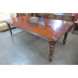 A Victorian mahogany extending dining table