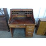 A Victorian mahogany tambour roll top desk