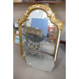 A rococo style parcel gilt framed mirror and an Art Deco mirror
