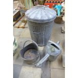 A galvanised bin, watering can and coal scuttle