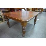 A Victorian oak dining table