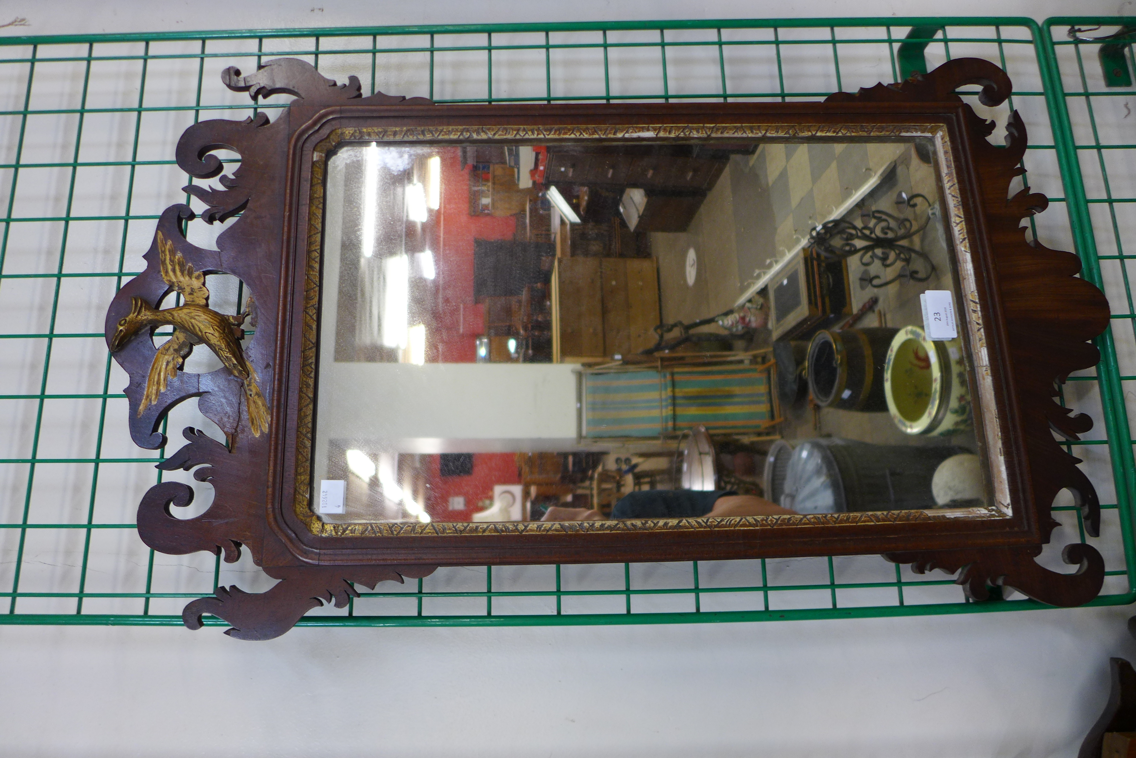 A George II mahogany and parcel gilt framed mirror