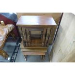 An oak nest of tables and mahogany nest of tables