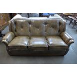 An Art Forma olive green leather Chesterfield style settee