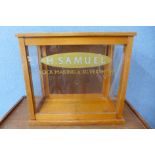 An oak counter top shop shop cabinet, bearing H. Samuel inscription to glass