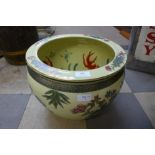 An oriental porcelain fish bowl