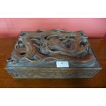 A Chinese carved softwood box, 10cms h, 30cms w, 20cms d