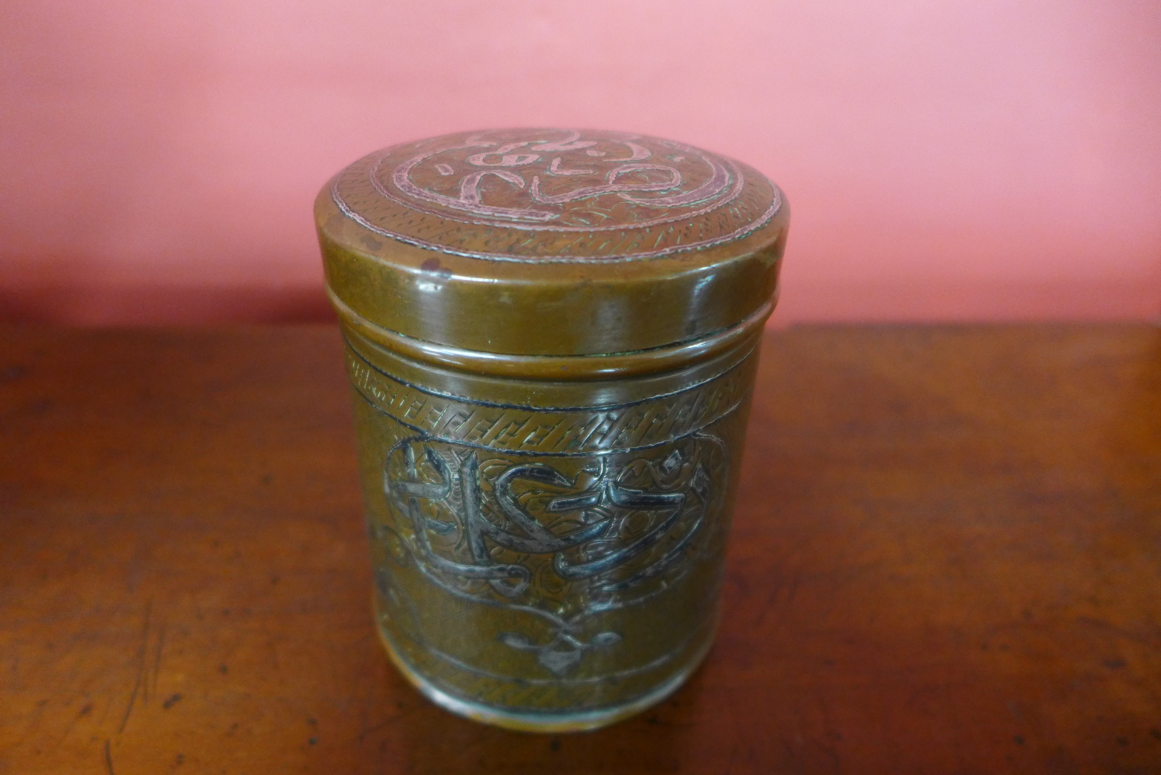 A late 19th/early 20th Century Islamic Mamluk revival silver inlaid copper jar and cover, 10cms h - Image 2 of 4