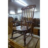 A Victorian elm and beech farmhouse rocking chair