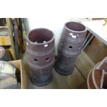 A pair of glazed terracotta chimney-pots