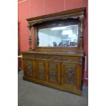 A Victorian carved walnut mirrorback sideboard