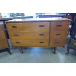 A teak chest of drawers