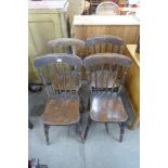 A set of four Victorian elm and beech kitchen chairs