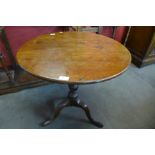 A George III mahogany circular tilt-top tea table