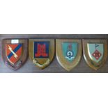 Four regimental plaques