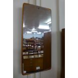 A teak framed mirror