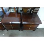 A pair of Stag Minstrel bedside chests