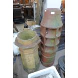 A terracotta chimney-pot and one other