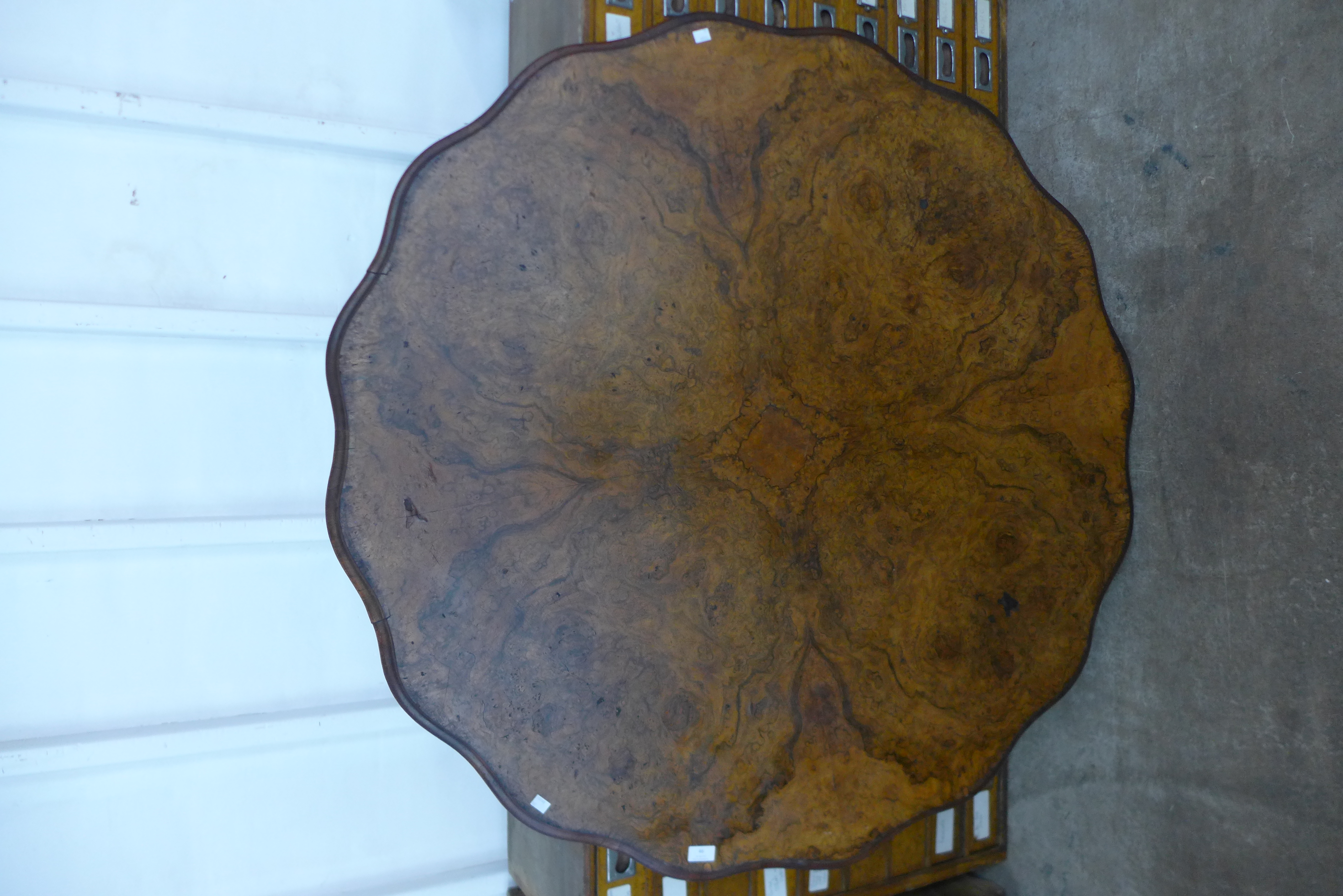 A Victorian burr walnut breakfast table top, 126cms d