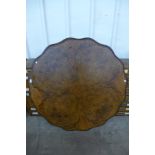 A Victorian burr walnut breakfast table top, 126cms d