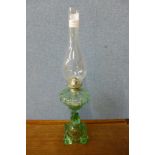 A green glass oil lamp