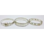 Two hallmarked silver bangles and one other silver bangle decorated with wild animals, 62g