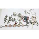 Silver jewellery including a fairy brooch, and a large heart shaped pendant
