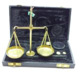 A cased set of balance scales and weights