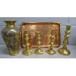 A decorated Eastern vase, four brass candlesticks and a hammered copper tray **PLEASE NOTE THIS