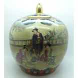 A Chinese lidded jar, decorated with figures